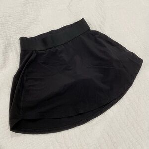 Aritzia TnaAction Black Tennis Micro Skirt with Serve Pockets